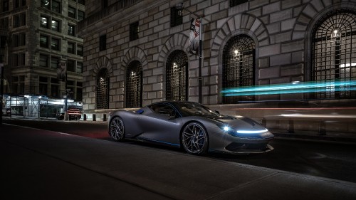 Image black coupe parked beside building