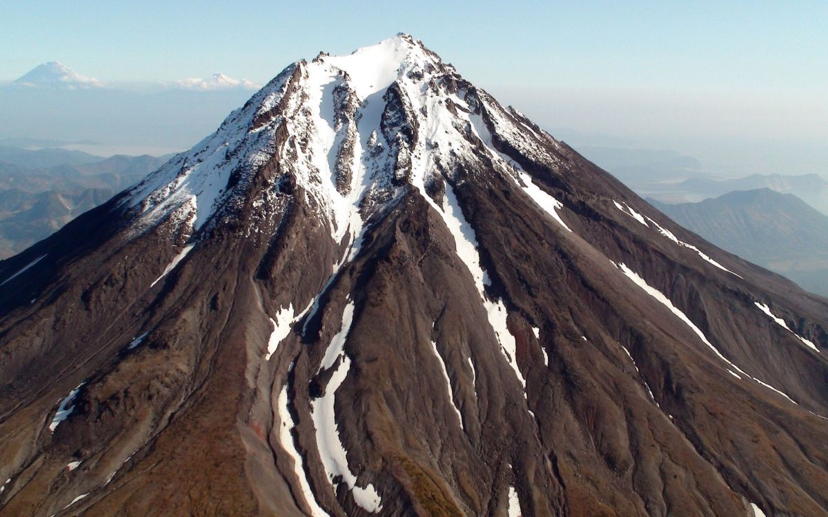 brown and white mountain under blue sky during daytime