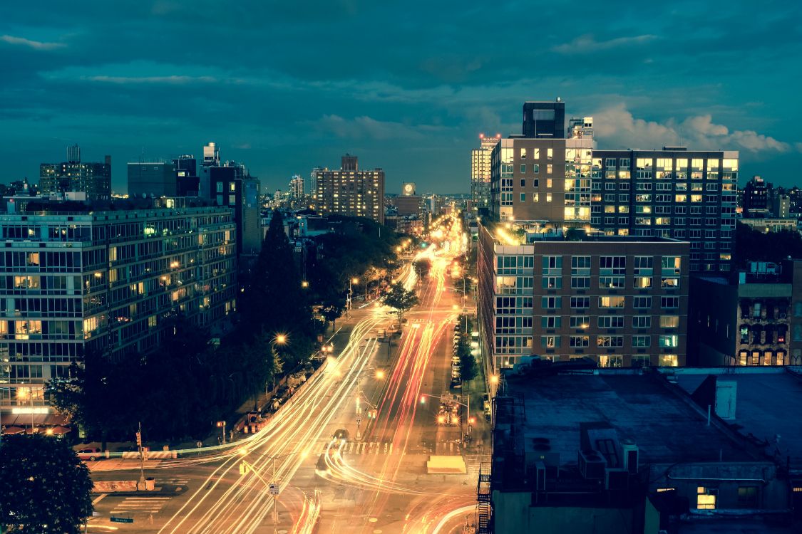 time lapse photography of cars on road during night time