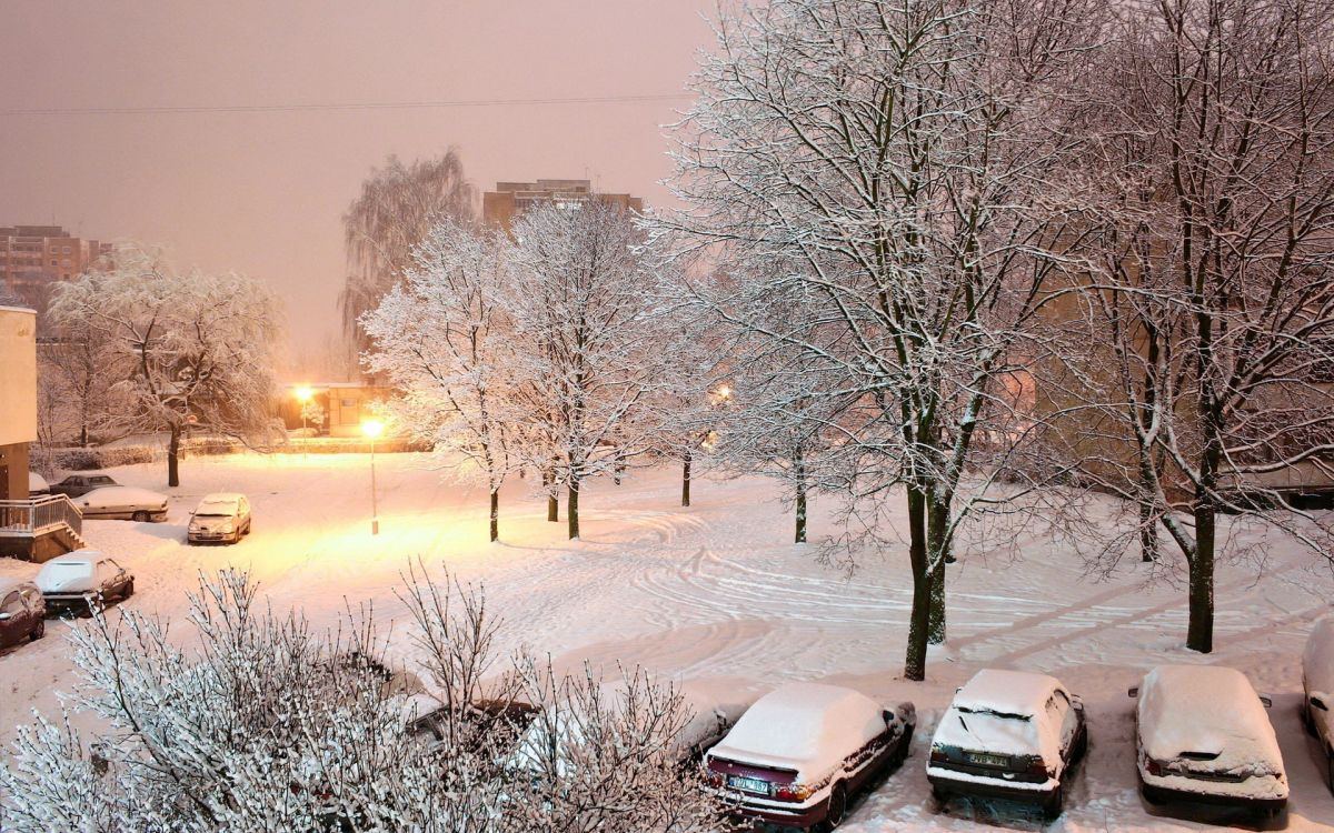 black car on snow covered road during daytime