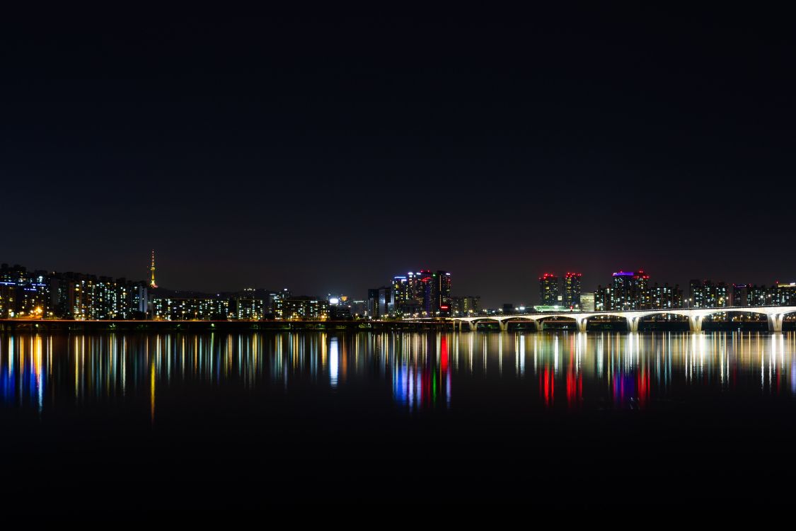 city skyline during night time