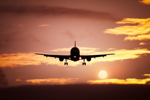 Image airplane flying in the sky during sunset