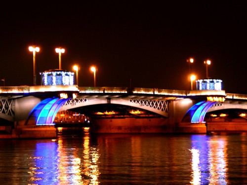 Image white and brown bridge during night time