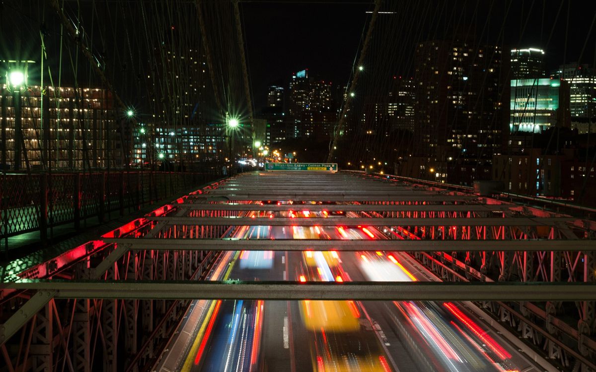 time lapse photography of cars on road during night time