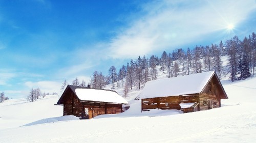 Image brown wooden house on snow covered ground during daytime