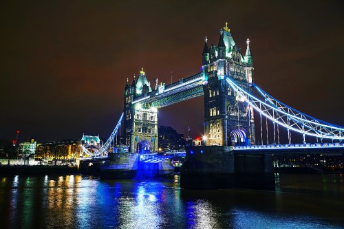 Image bridge over water during night time