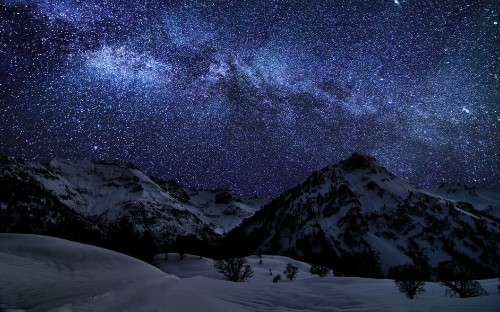 Image snow covered mountain under starry night