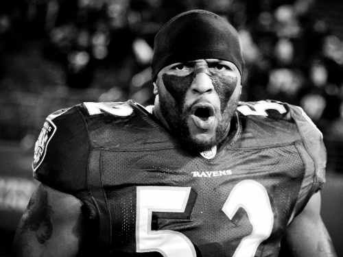 Image grayscale photo of man in black and white jersey shirt