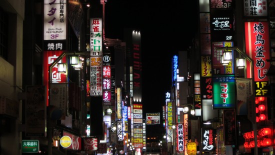 Image people walking on street during night time