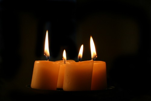 Image 3 lighted candles on black background