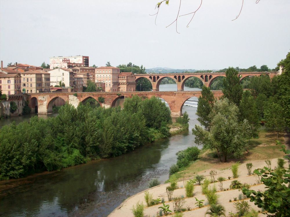 brown concrete bridge over river