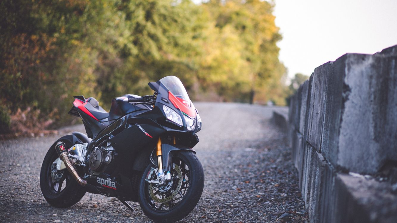 black and white sports bike parked on the road during daytime