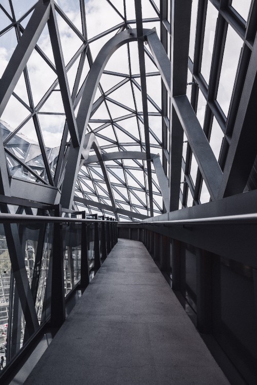 Image gray metal bridge during daytime