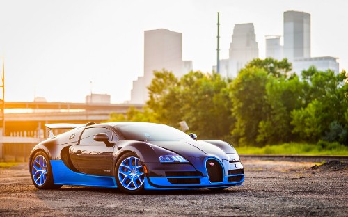 Image blue lamborghini aventador parked on gray asphalt road during daytime