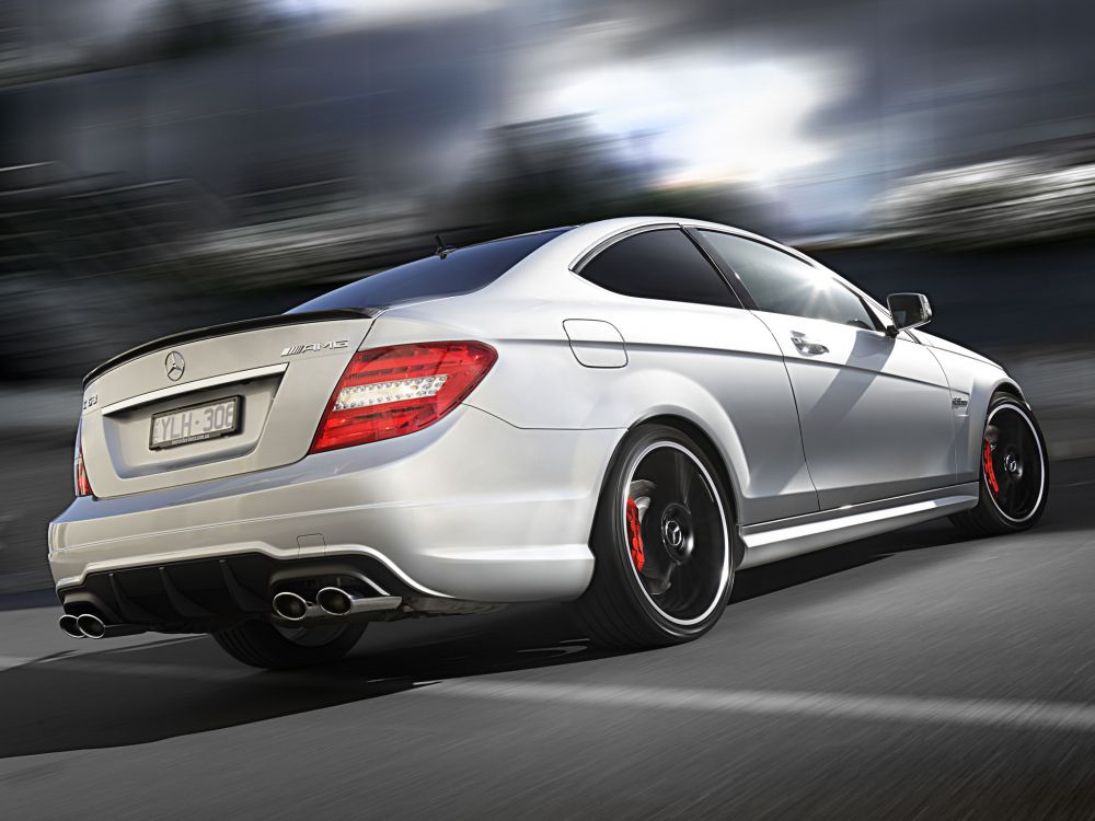 white mercedes benz coupe on road