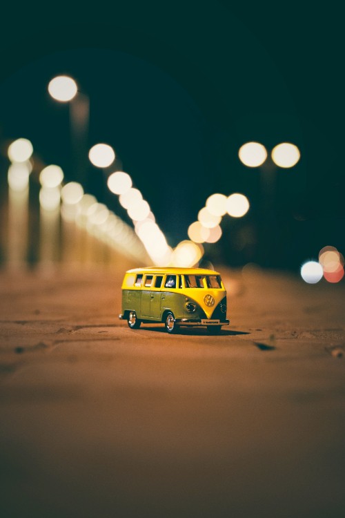 Image yellow bus on road during night time