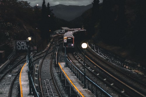 Image train on rail road during daytime