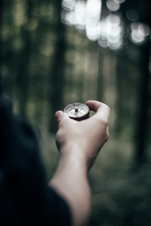 Image person holding silver round coin