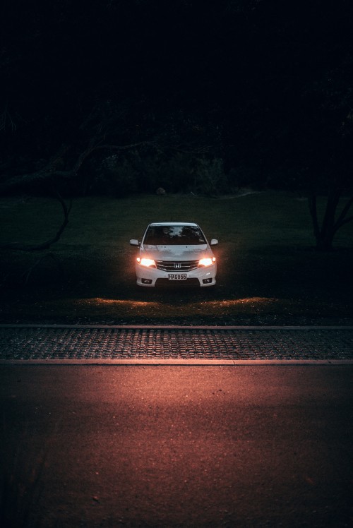 Image white car on road during night time