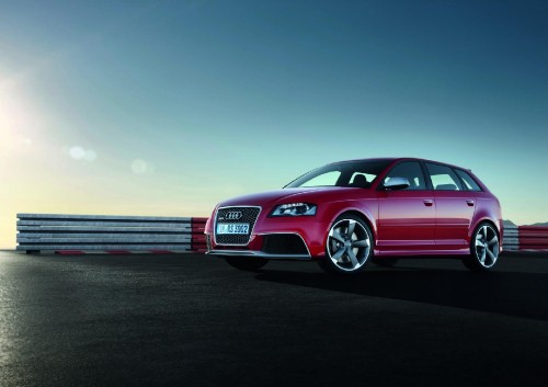 Image red audi a 4 on a gray asphalt road