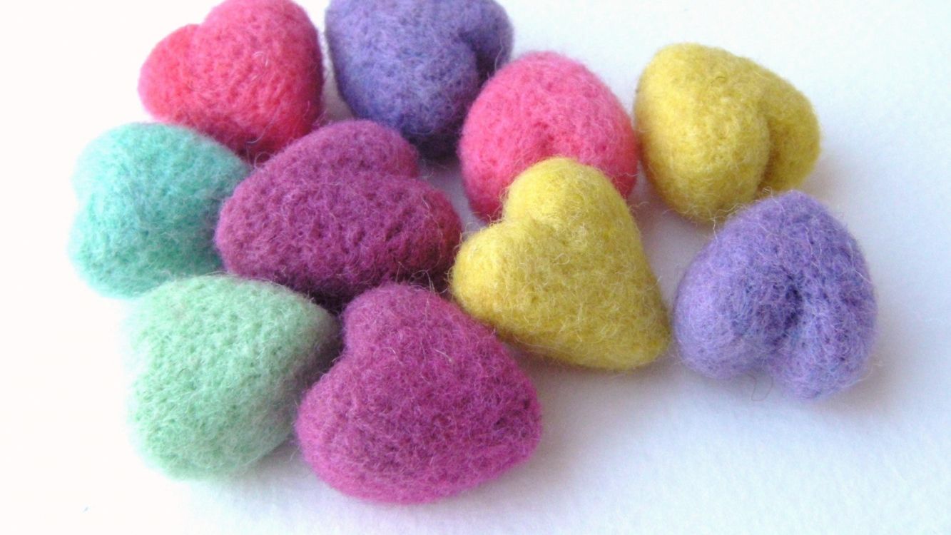 yellow pink and blue round candies