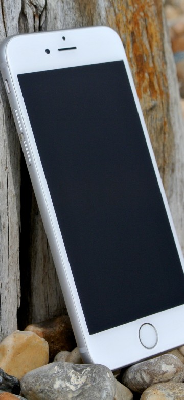 Image silver iphone 6 on brown wooden table