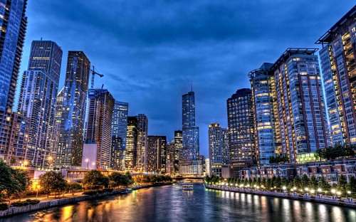 Image city skyline near body of water during night time