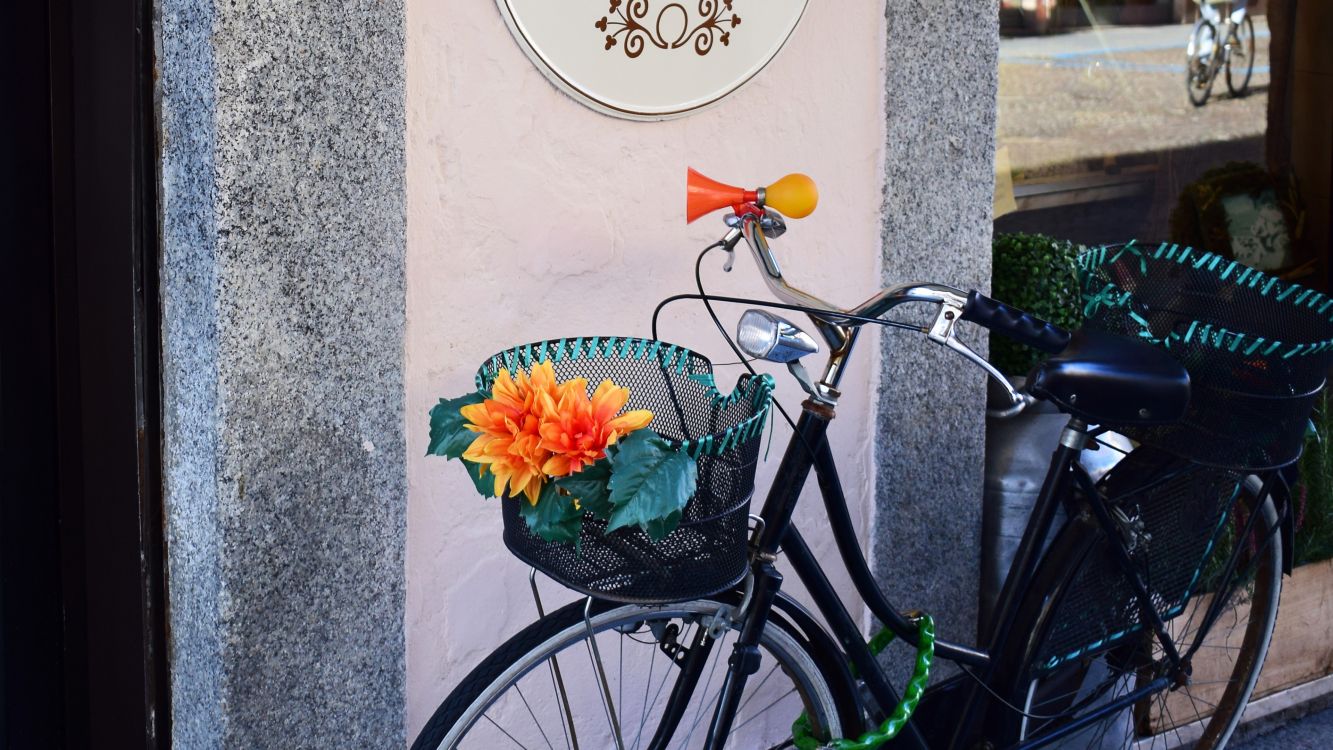 black city bike beside wall