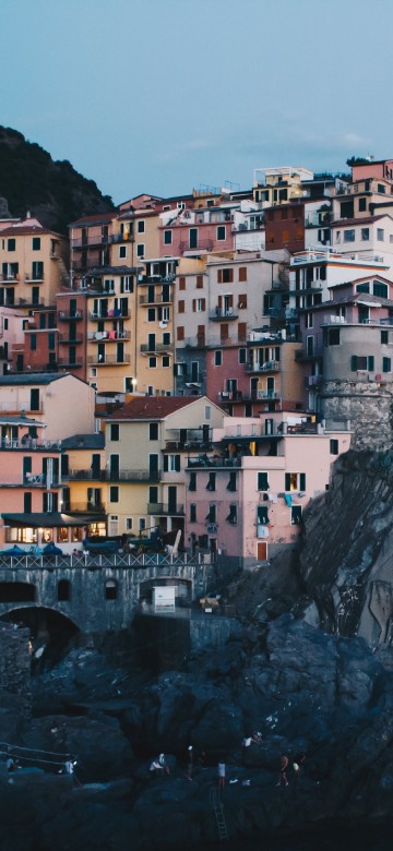 Image white and brown concrete buildings on mountain