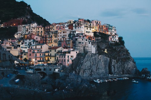 Image white and brown concrete buildings on mountain