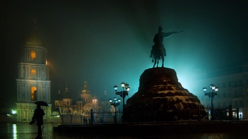 Image statue of man riding horse during night time