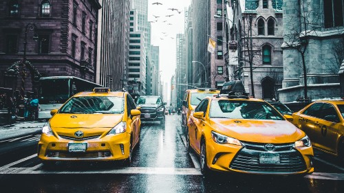 Image yellow car on road during daytime