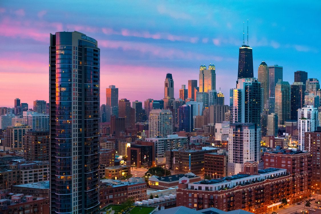 city skyline under blue sky during daytime