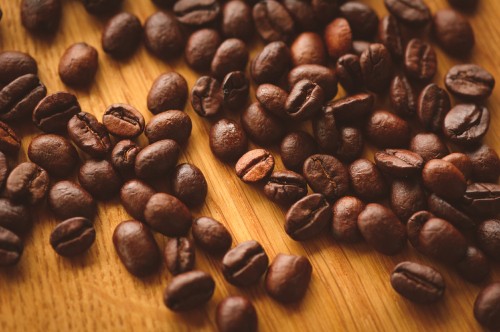 Image coffee beans on brown wooden table