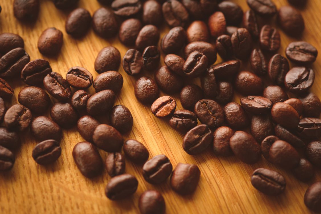 coffee beans on brown wooden table