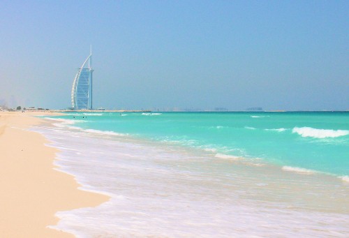 Image white and blue sea waves crashing on shore during daytime