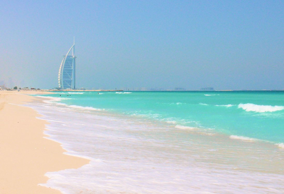 white and blue sea waves crashing on shore during daytime