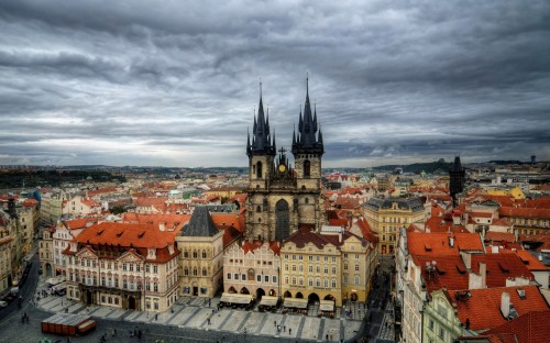 Image aerial view of city buildings under cloudy sky during daytime