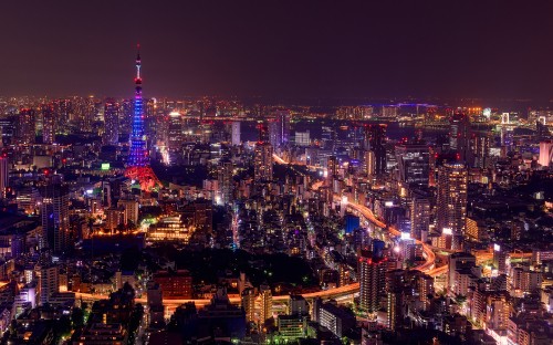 Image city with high rise buildings during night time