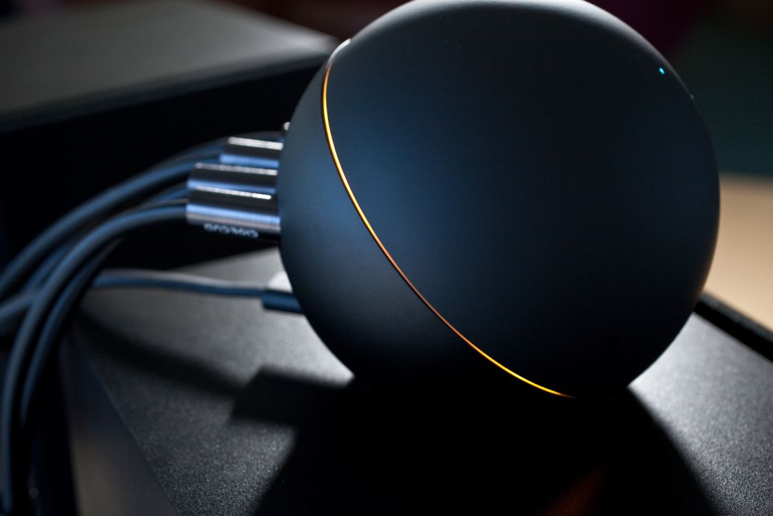 black round device on black table