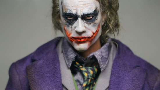 Image woman in purple cardigan with face paint