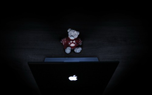 Image red bear plush toy on macbook