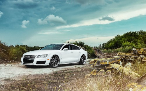 Image white mercedes benz coupe on brown wooden log during daytime