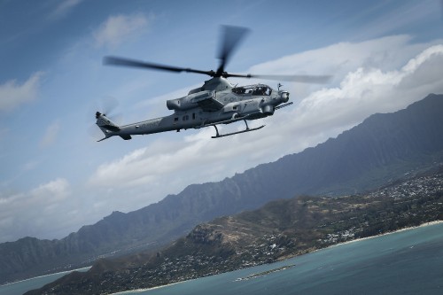 Image black and white helicopter flying over the mountain during daytime