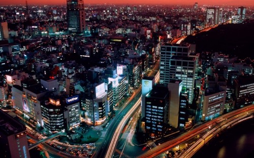 Image city with high rise buildings during night time