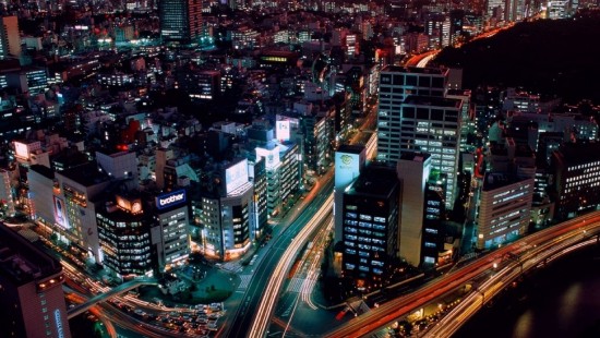 Image city with high rise buildings during night time