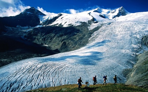 Image people walking on snow covered ground near snow covered mountain during daytime