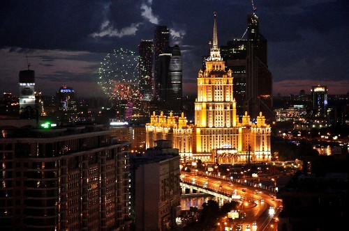 Image city buildings with lights turned on during night time