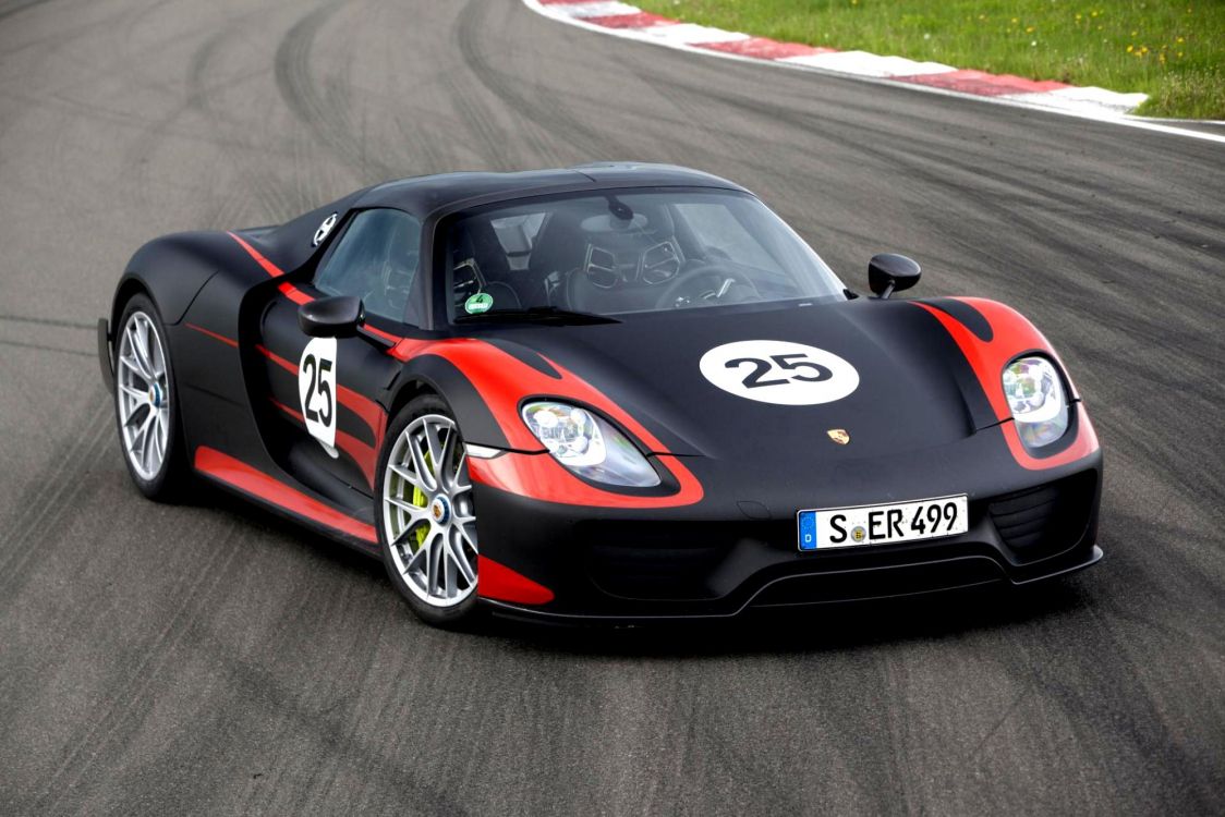 Black and Red Ferrari Sports Car on Road. Wallpaper in 1997x1332 Resolution