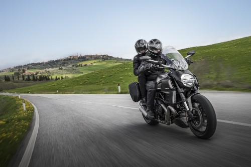 Image man in black helmet riding motorcycle on road during daytime